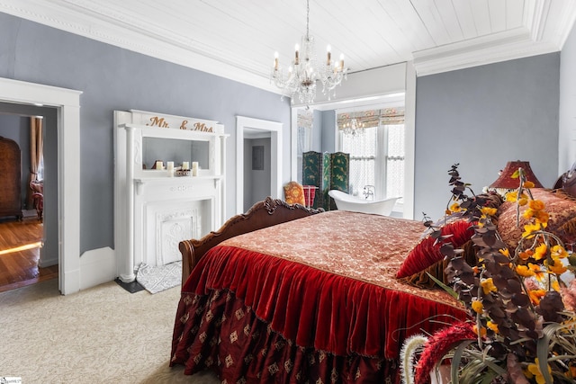 bedroom featuring a chandelier, crown molding, and carpet floors