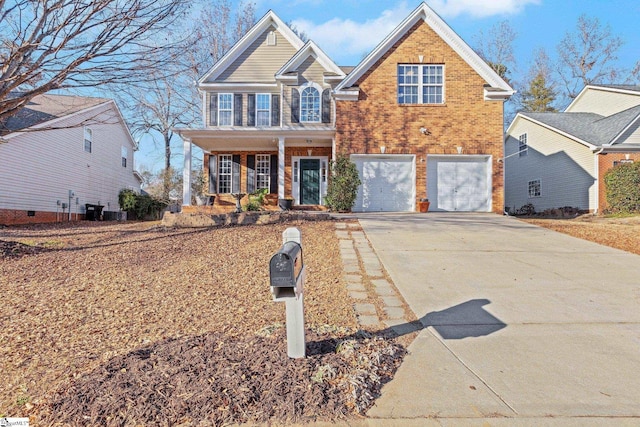 view of front of property with a garage and a porch