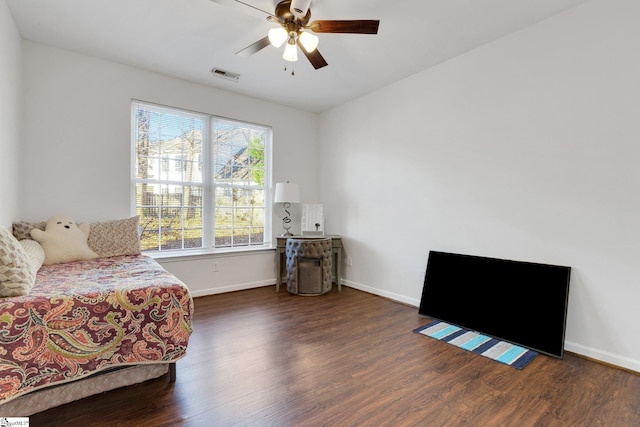 bedroom featuring ceiling fan and dark hardwood / wood-style flooring