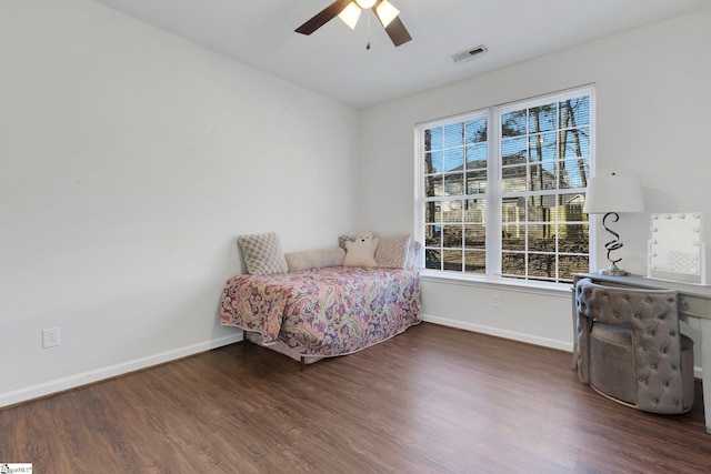 bedroom with ceiling fan and dark hardwood / wood-style flooring