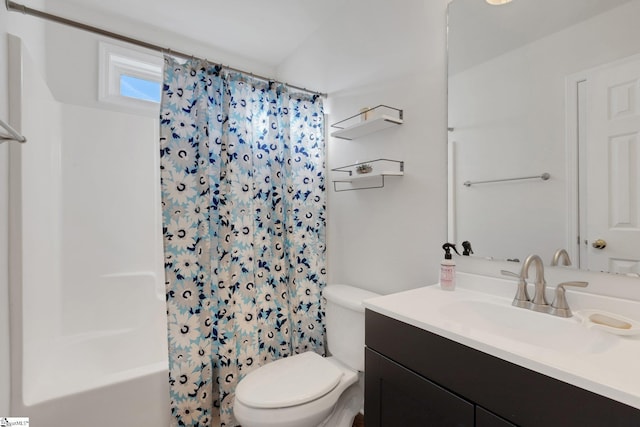 full bathroom with vanity, shower / bath combo, and toilet