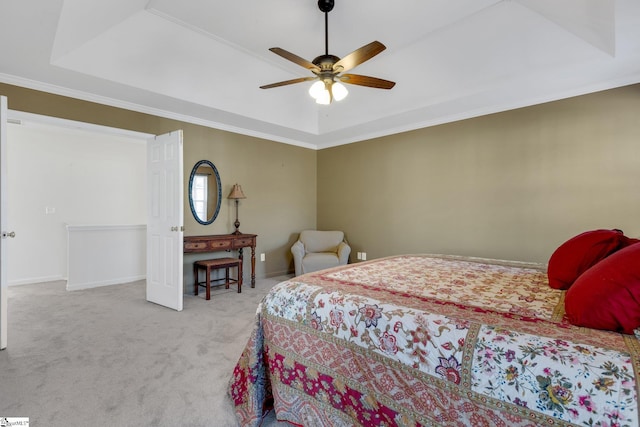 bedroom with crown molding, ceiling fan, a raised ceiling, and light carpet