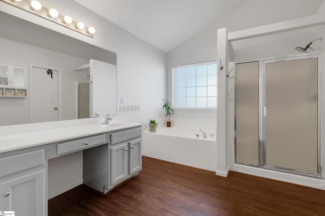 bathroom featuring hardwood / wood-style flooring, lofted ceiling, independent shower and bath, and vanity