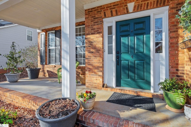 property entrance with covered porch