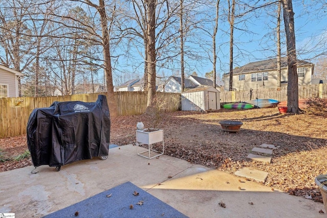 view of patio featuring a shed