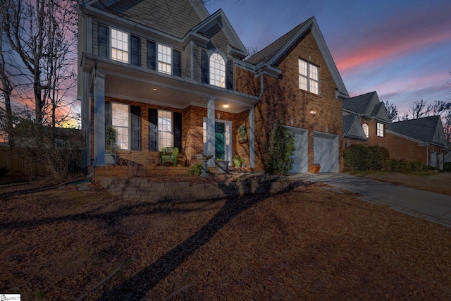 view of front facade featuring a garage and covered porch