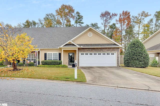 view of front of house featuring a front lawn and a garage