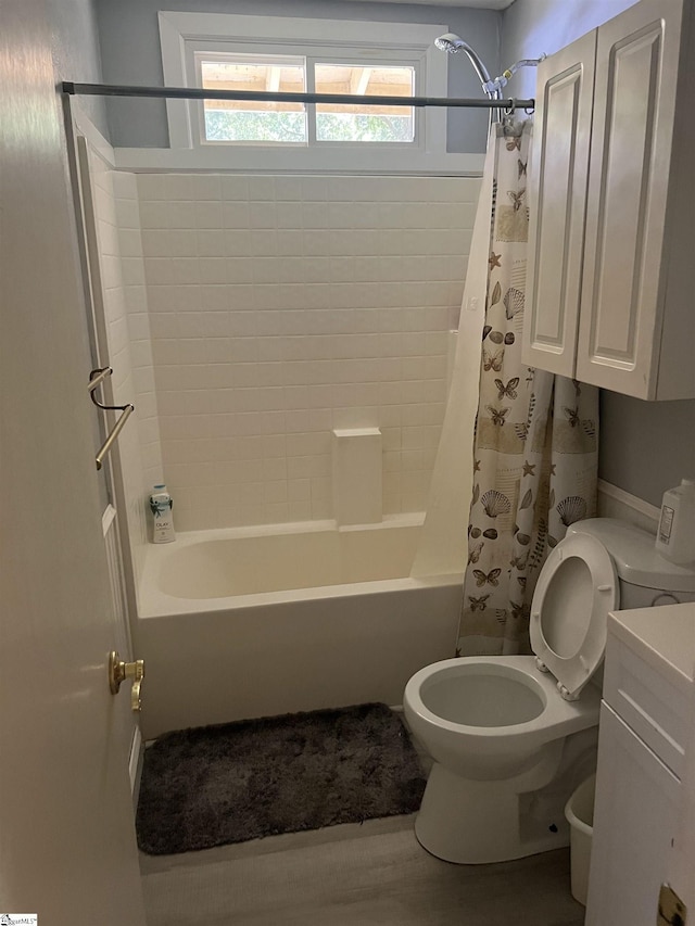 bathroom featuring toilet and shower / bath combo