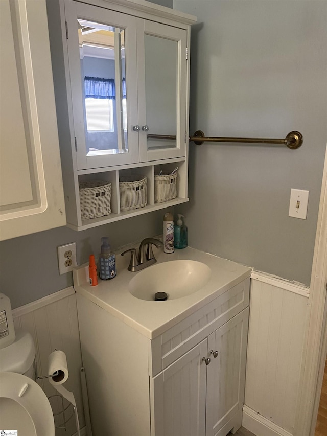 bathroom with toilet and vanity