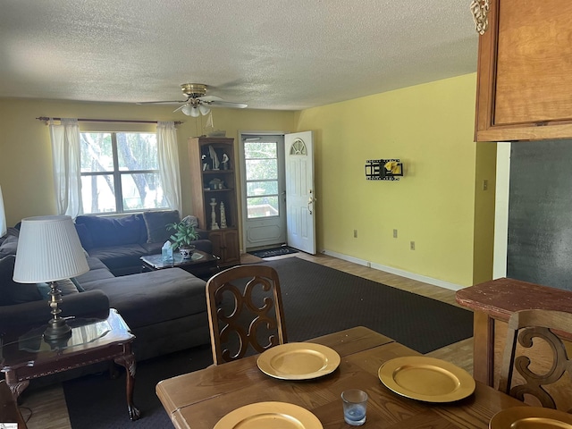 living room featuring ceiling fan and hardwood / wood-style flooring