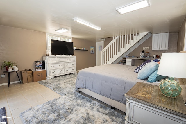 bedroom with light tile patterned floors