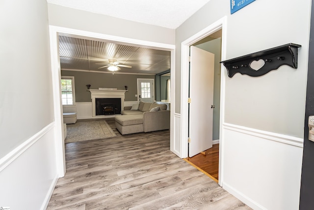 corridor with hardwood / wood-style floors