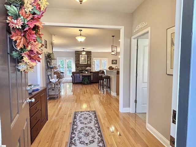 corridor featuring light hardwood / wood-style floors