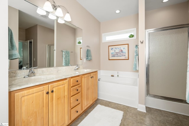 bathroom with tile patterned floors, vanity, and separate shower and tub