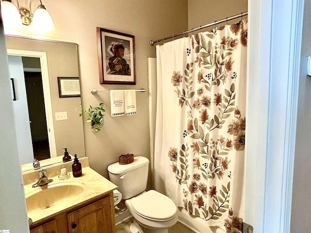 bathroom with toilet and vanity