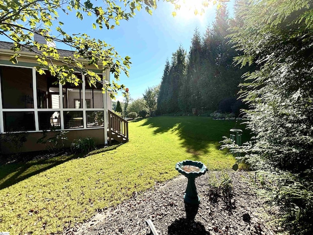 view of yard featuring a sunroom