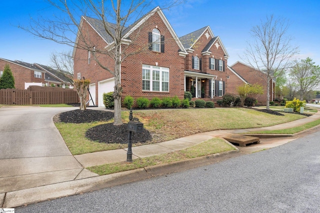 view of front property featuring a garage and a front yard