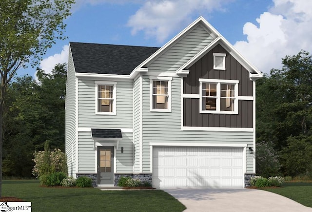 view of front of home with a front lawn and a garage