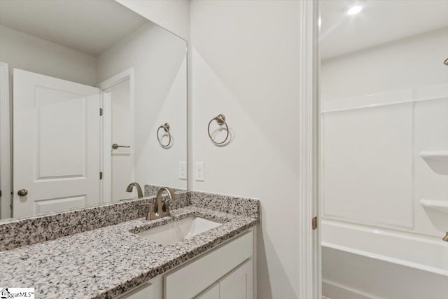 bathroom with vanity and bathtub / shower combination