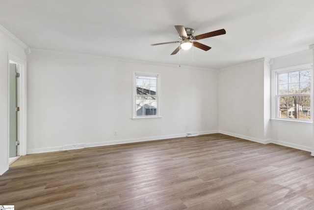 unfurnished room featuring ceiling fan, hardwood / wood-style floors, and ornamental molding