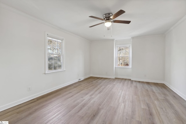 spare room with light wood-type flooring, ceiling fan, a healthy amount of sunlight, and crown molding