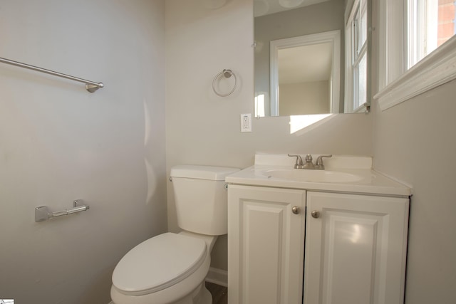 bathroom with toilet and vanity