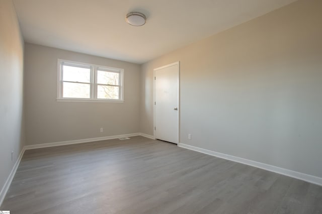 spare room with light hardwood / wood-style floors