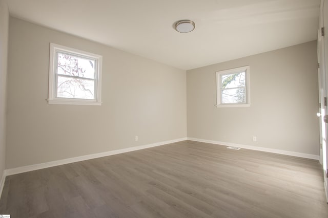 spare room featuring hardwood / wood-style floors