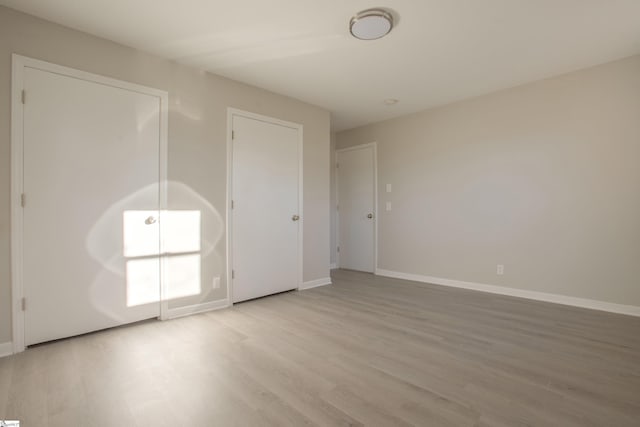 spare room featuring hardwood / wood-style flooring