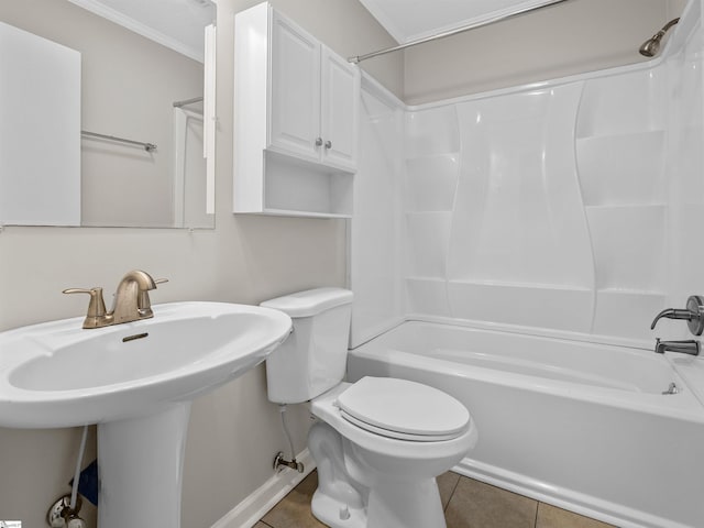 bathroom featuring shower / bathtub combination, tile patterned floors, and toilet