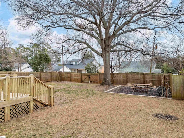 view of yard featuring a wooden deck