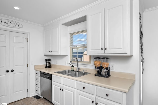 kitchen featuring crown molding, stainless steel dishwasher, white cabinets, and sink