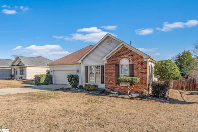 view of property featuring a front yard and a garage