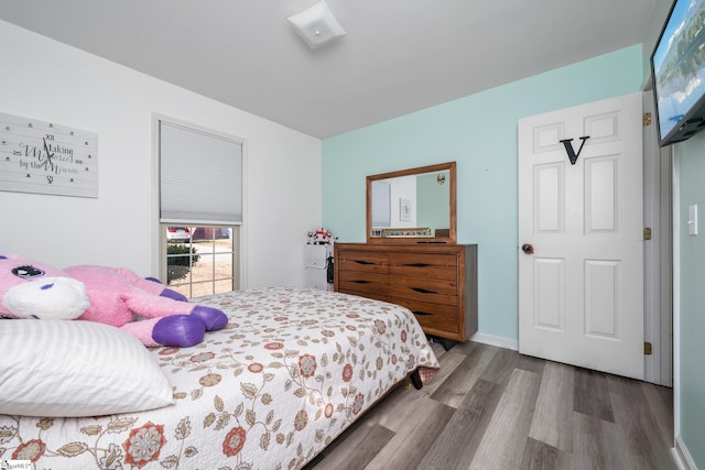 bedroom with hardwood / wood-style flooring