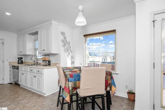 dining space featuring sink and ornamental molding