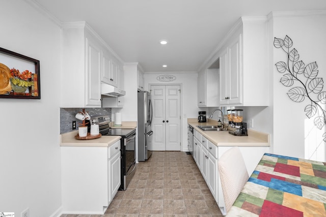 kitchen with sink, white cabinets, and appliances with stainless steel finishes