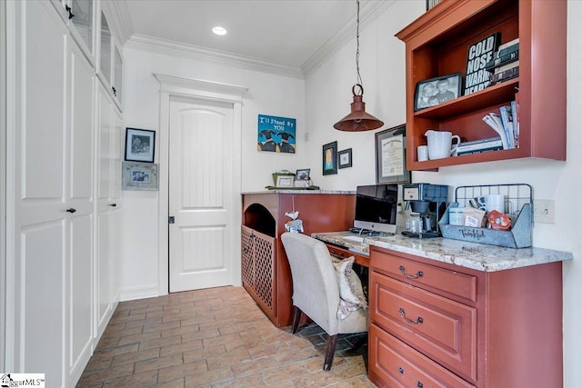 office space featuring crown molding and built in desk