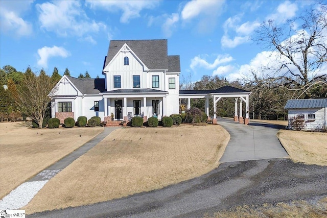 view of front of house featuring a porch, a gazebo, and a shed