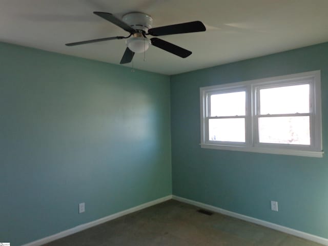 unfurnished room with ceiling fan