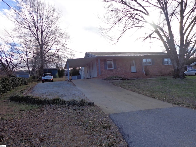 view of side of home with a carport