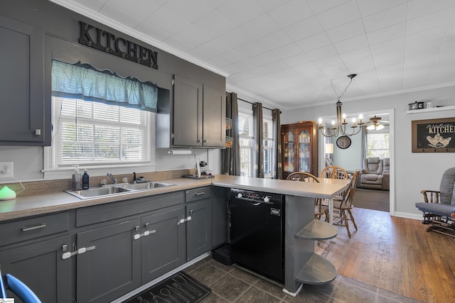 kitchen with decorative light fixtures, black dishwasher, ornamental molding, and a healthy amount of sunlight