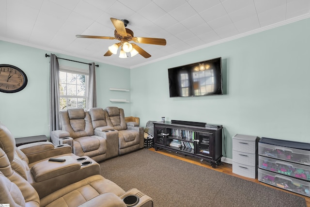 living room with ceiling fan and crown molding