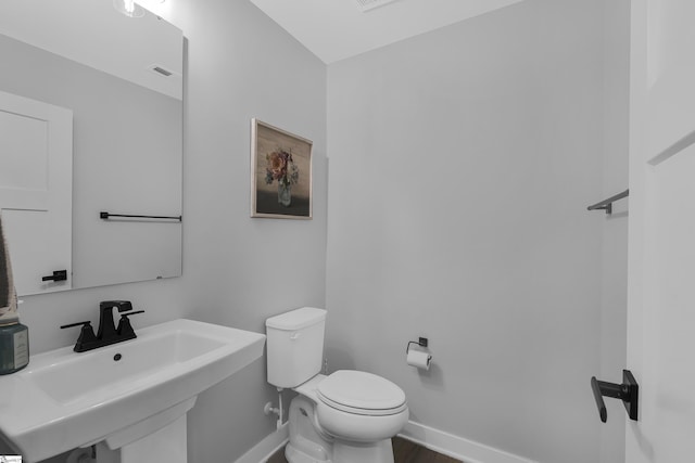 bathroom with toilet and sink