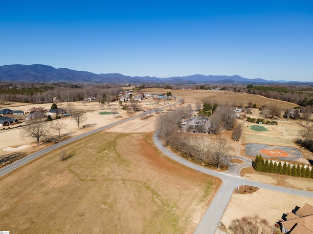 birds eye view of property with a mountain view