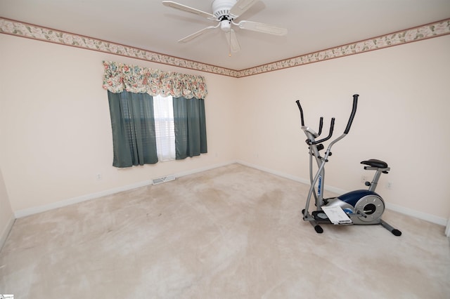 workout room featuring ceiling fan and carpet floors