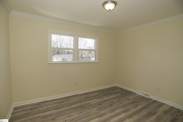 unfurnished room featuring ornamental molding and dark hardwood / wood-style floors