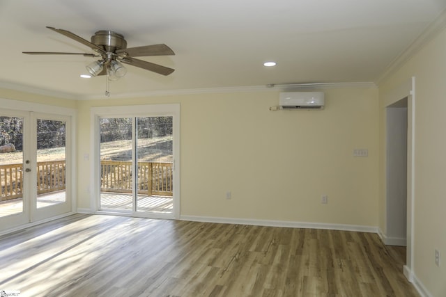 empty room with ceiling fan, a wealth of natural light, crown molding, and a wall unit AC