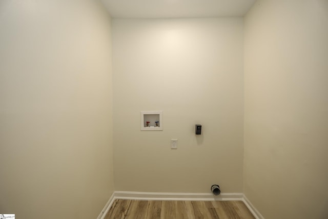 laundry room featuring washer hookup and hardwood / wood-style flooring