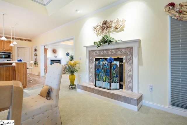 carpeted living room featuring crown molding and a fireplace