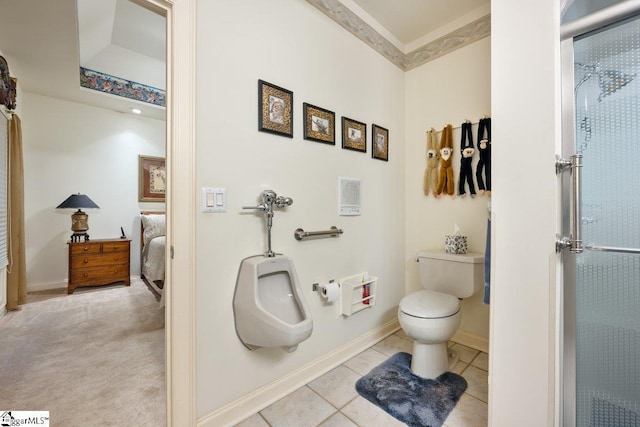 bathroom with toilet, a shower, and tile patterned flooring